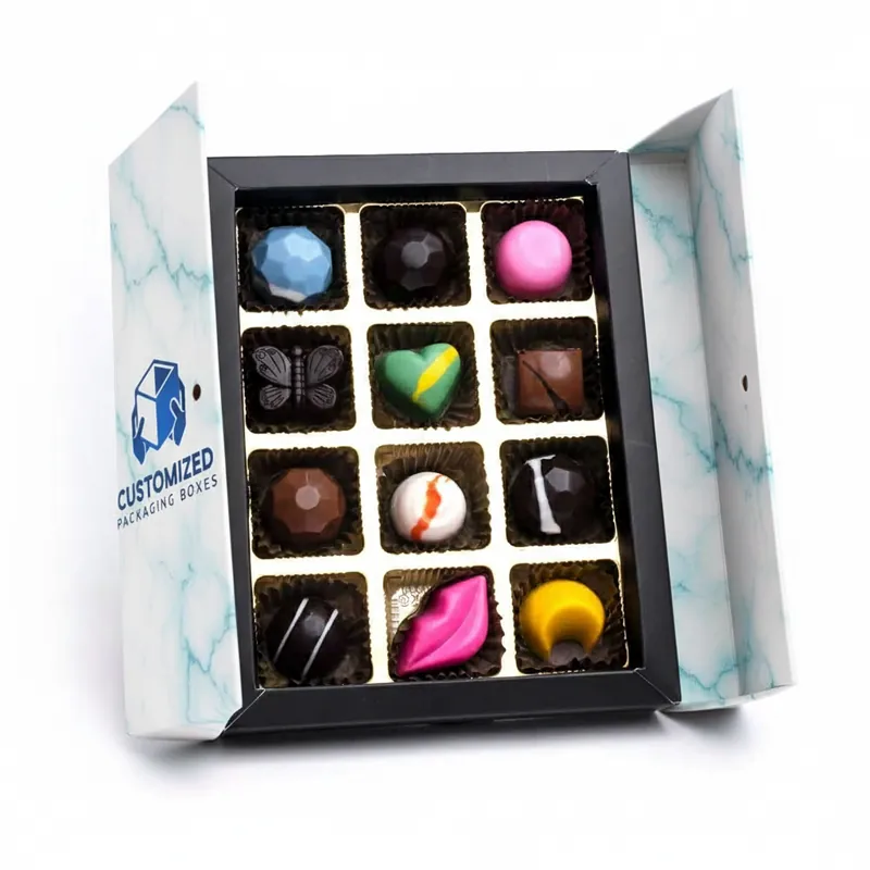 A stylized bonbon box features assorted confections, showcasing a variety of shapes and possibly flavors.
