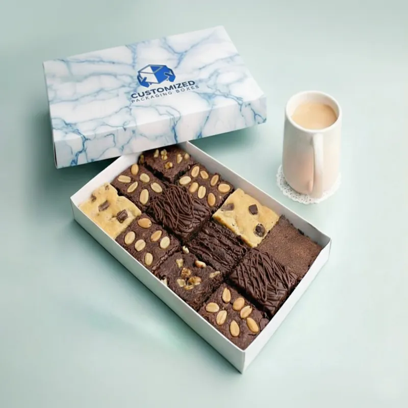 A brownie box with the brand's logo centered on top of a gradient background.
