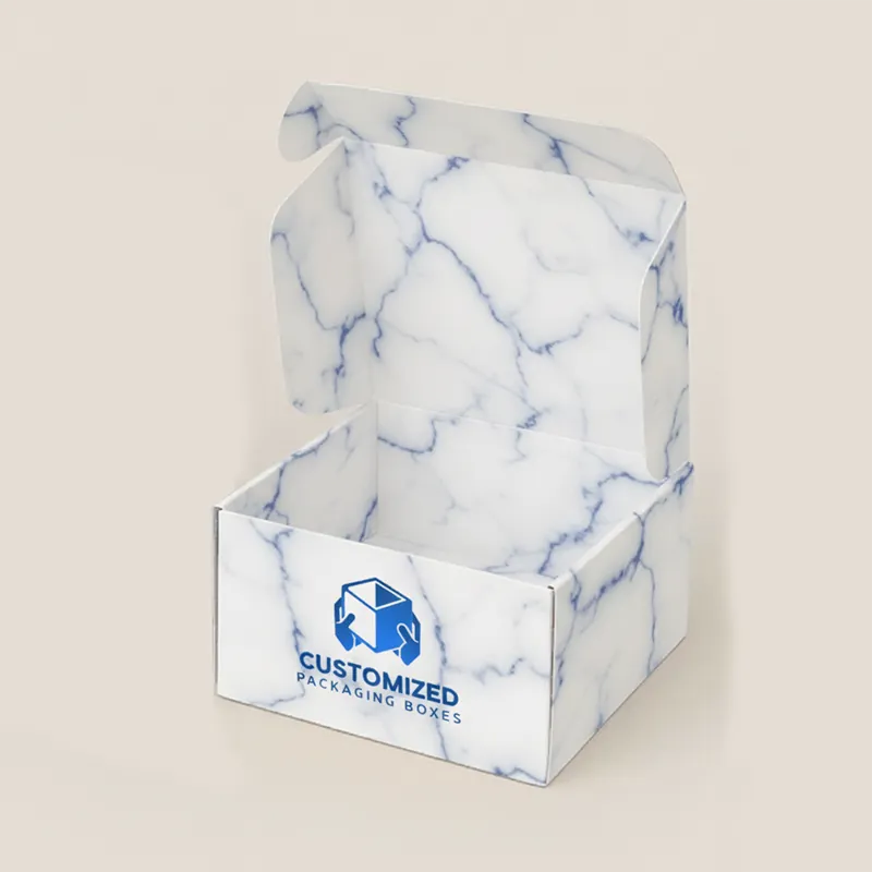 A cake box with a clear window on top, showcasing the cake inside.
