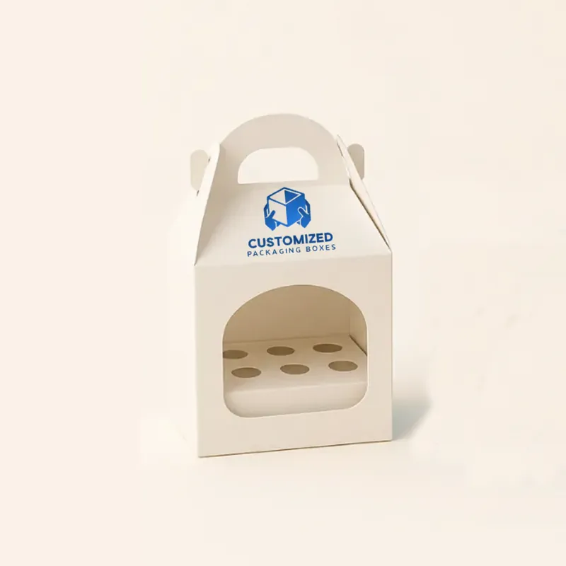 A cake pop box is white with a clear window to showcase the treats inside.