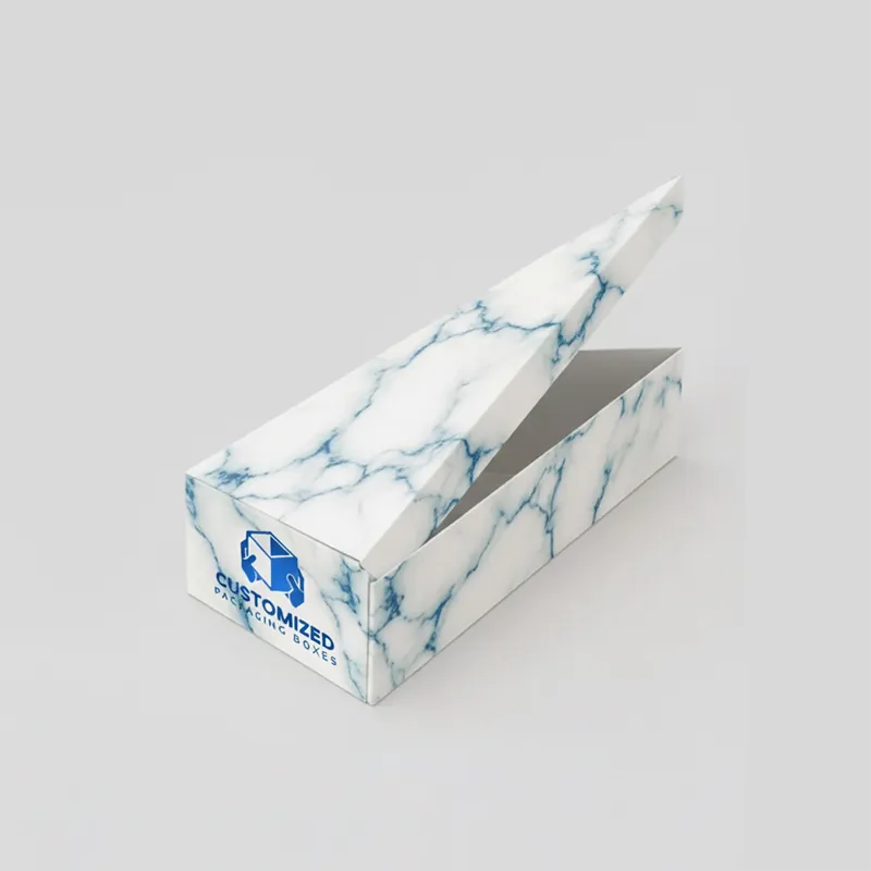 A cake slice box is open, revealing its triangular shape and packaging style.
