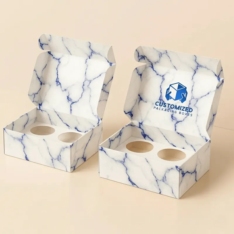 A variety of donuts are beautifully displayed in a stylishly designed packaging box, ready to be enjoyed.
