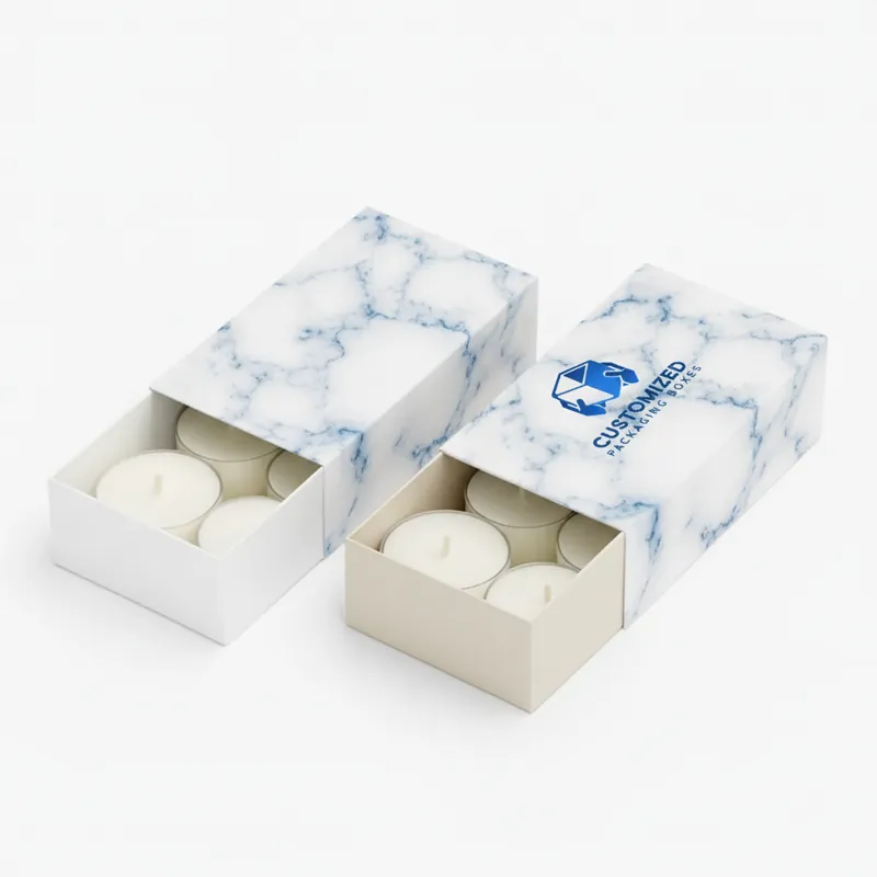 A printed candle sleeve box features a floral and geometric pattern in shades of brown, cream, and black.
