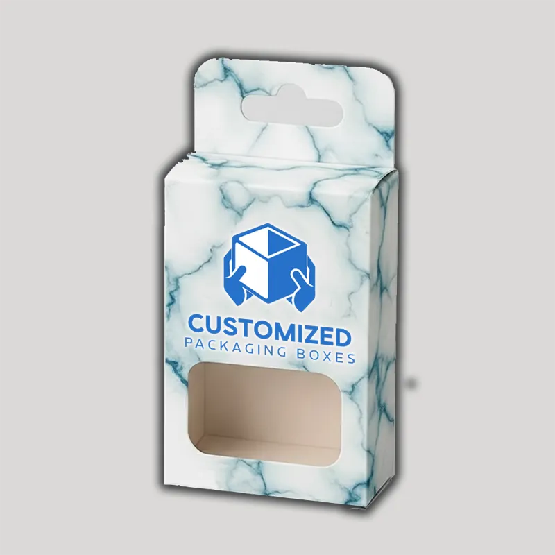 A compact blush box, likely made of cardboard, features a minimalist design and subtle branding elements.