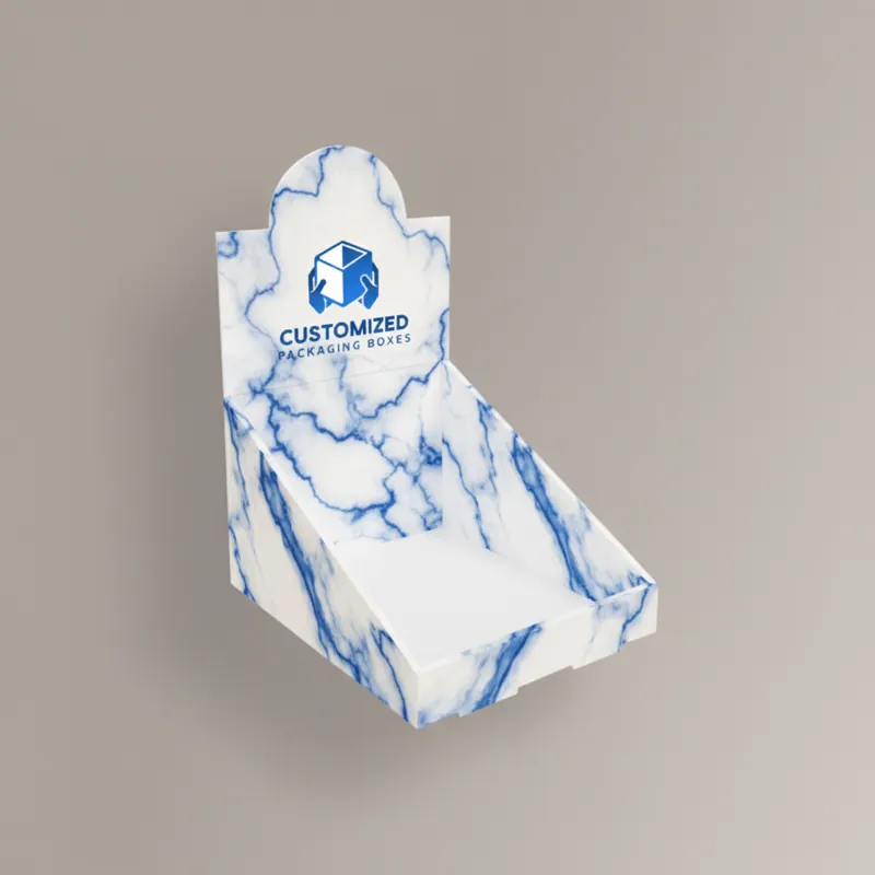 Counter display box with a low front panel and tall back panel, forming an open tray for retail products.