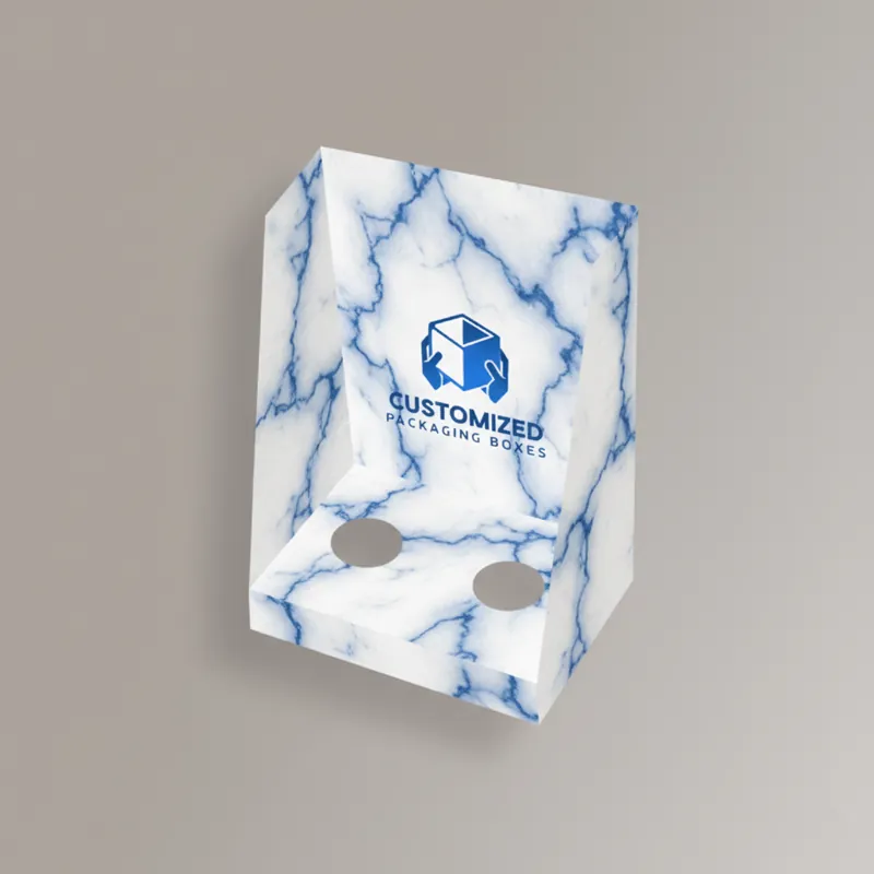 Open white display box with integrated punch partitions.