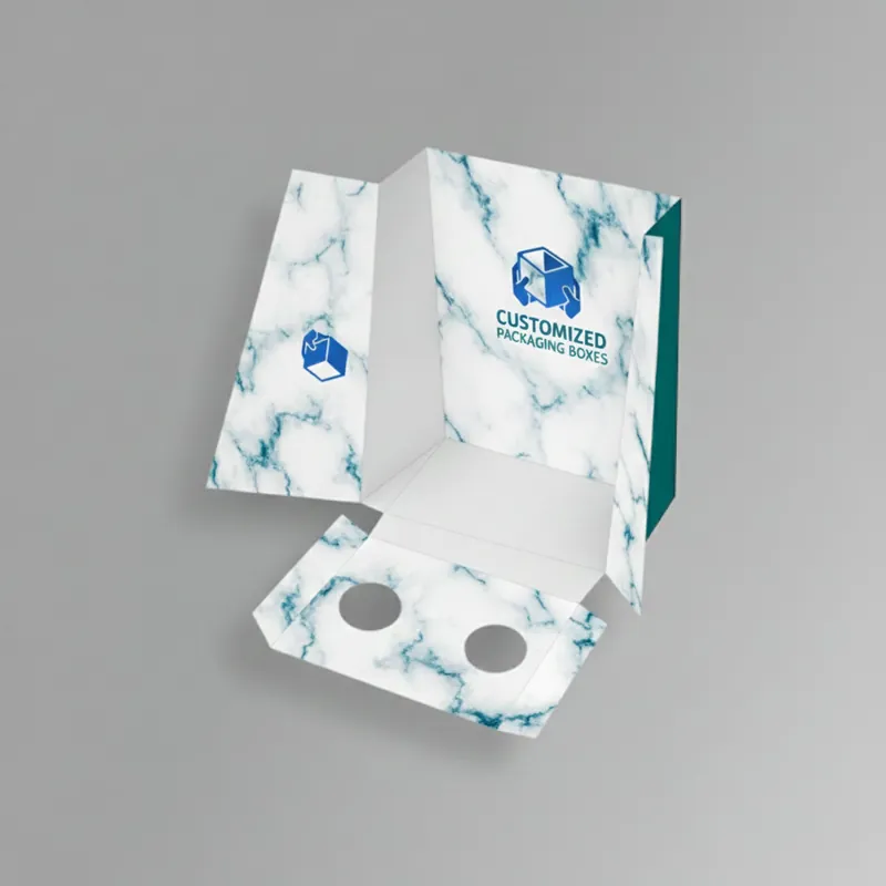 White display box with punched partitions for organized retail product display.